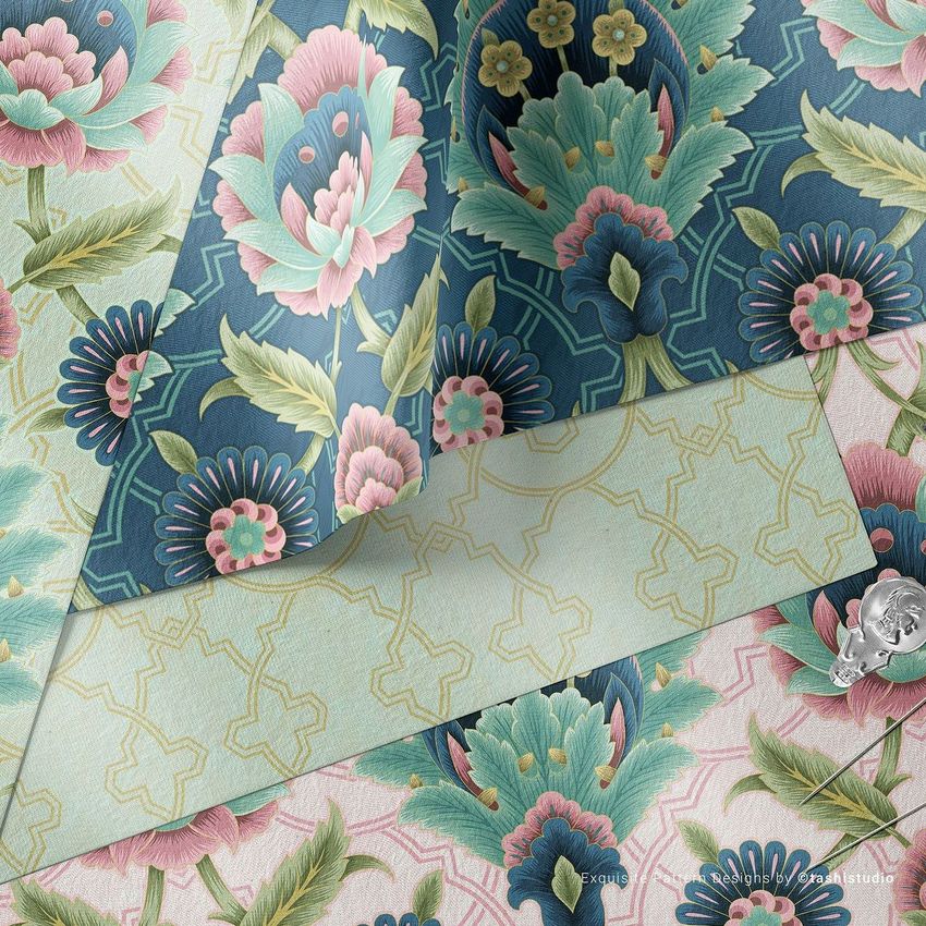Fabric layers mockup showing folded textile with floral patterns in teal, pink, and green, viewed from above on a flat surface.