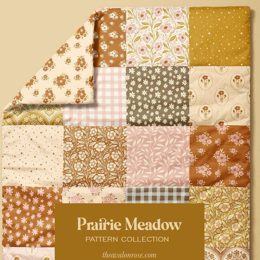 Baby patchwork quilt mockup featuring a variety of floral and geometric patterns in warm earth tones, shown on a beige background.