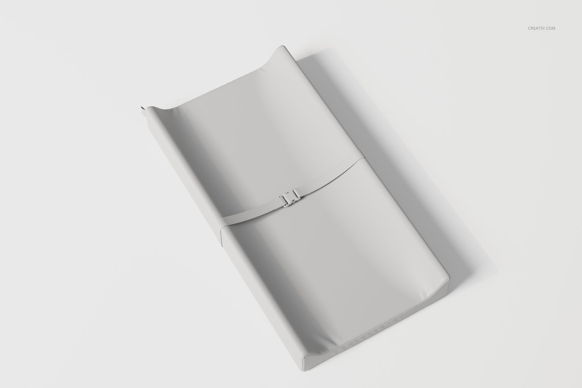 Contoured changing pad in light gray color shown from a high angle on a plain white background surface.