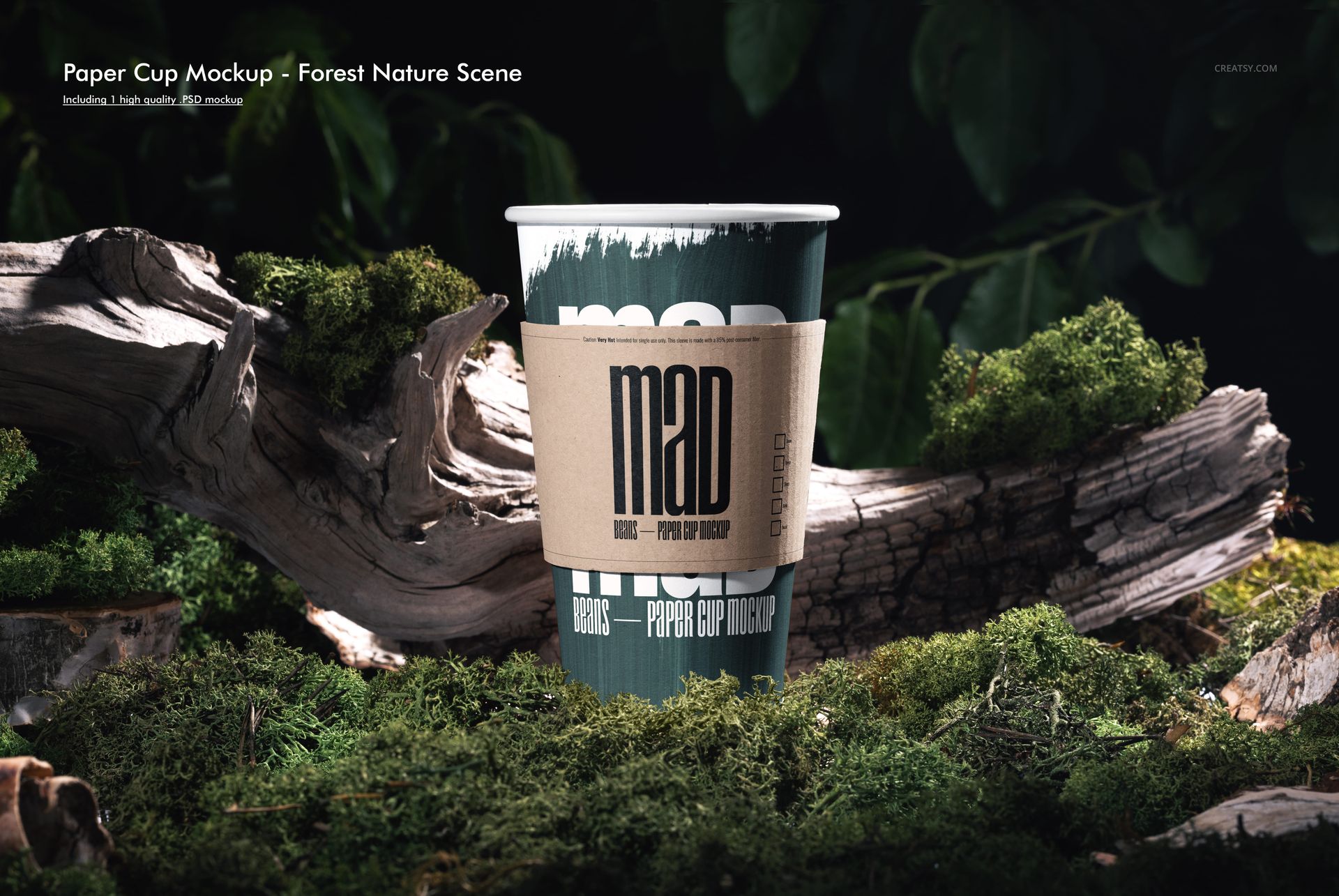Tall paper cup mockup featuring a natural sleeve, placed on moss-covered bark with leafy greenery in the background.