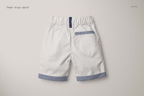 Back view of boys formal shorts mockup in white with blue striped trim on the pocket and leg cuffs on a plain background.