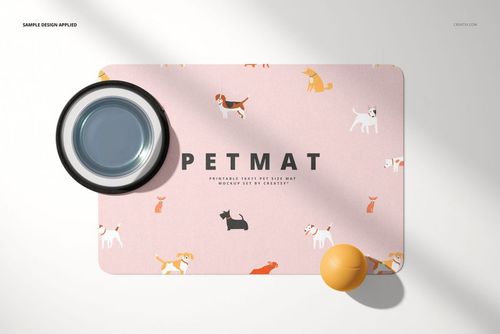 Top view of a rectangular pet door mat with a pink background, featuring playful dog illustrations, bowl, and toy ball.