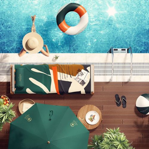 Top view of a poolside scene with a colorful towel on a lounge chair, a sun hat, and a swimming pool mockup.