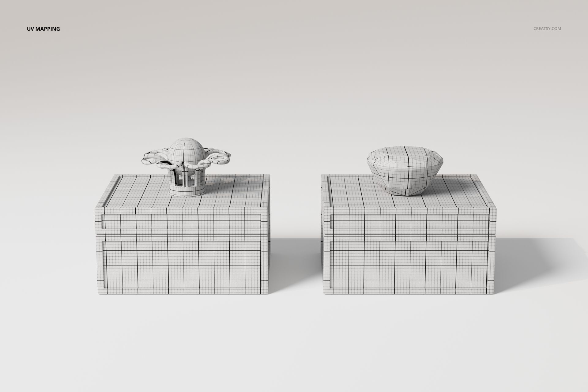 Front view of two art deco jewelry boxes with wireframe mesh design, placed side by side on a plain surface.