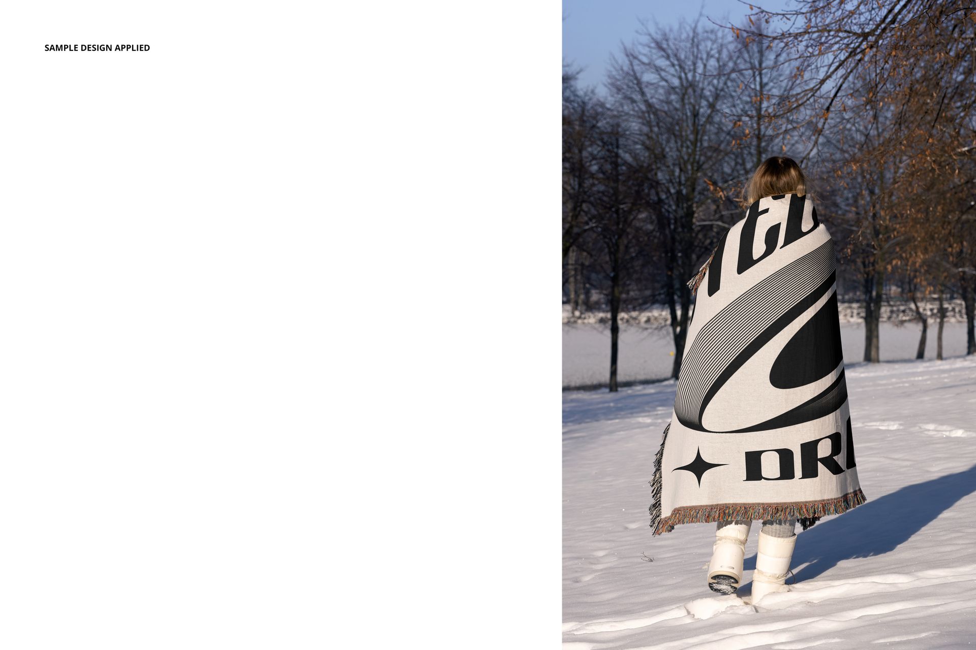 Jacquard woven blanket mockup shown draped over a person in snow, displaying large black and white design.