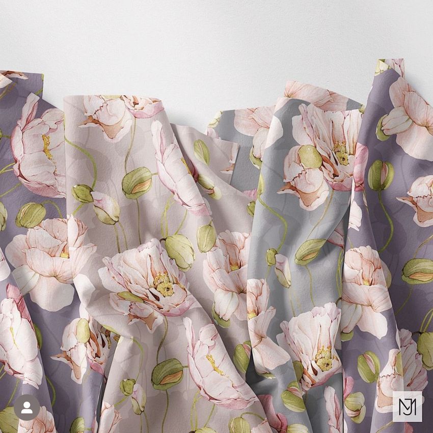 Creased fabrics mockup featuring draped cloth with a poppy flower pattern in soft pink, green, and gray tones on a white background.