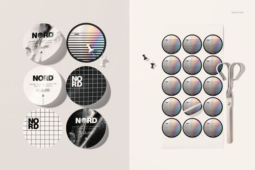 PSD mockup of circular stickers in monochrome and iridescent styles arranged on a light background with office accessories.