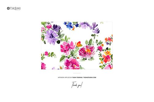 PSD mockup showing folded fabric with colorful flower prints, including pink, purple, and orange blooms, on white.