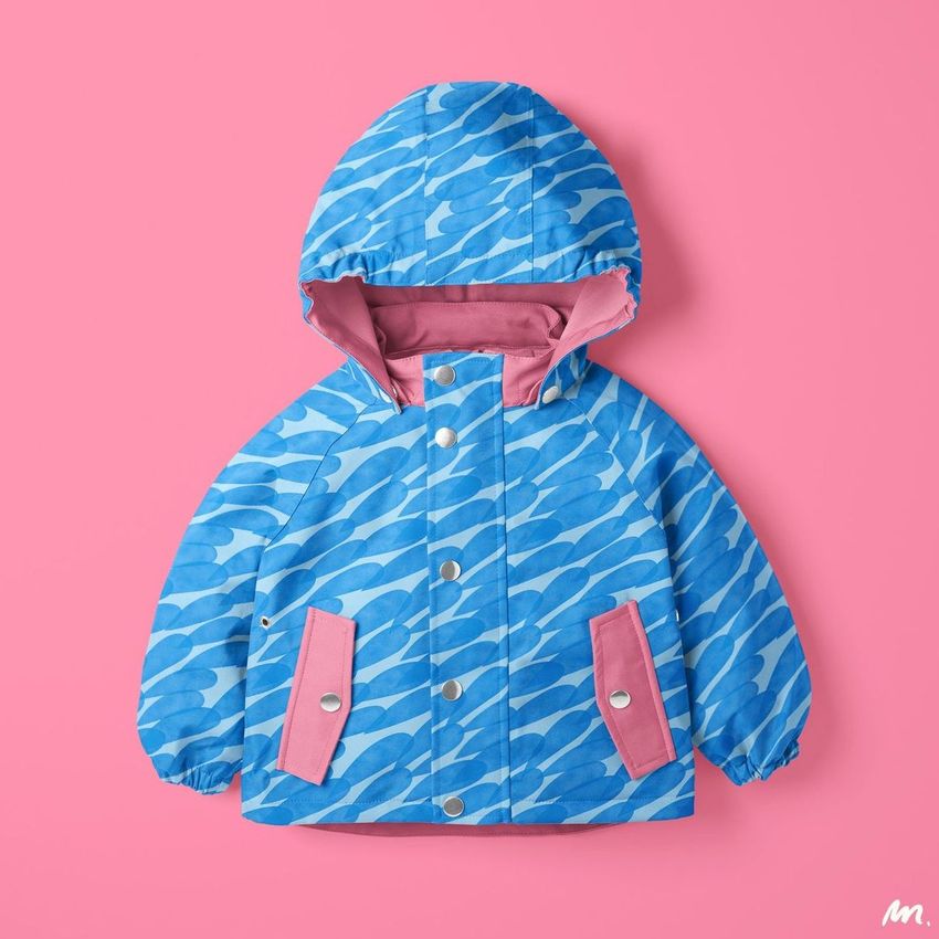 Kids rainwear mockup featuring a blue patterned hooded jacket with pink accents, displayed on a solid pink background.
