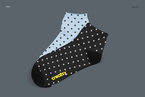 Mockup of two sublimation socks featuring star designs, shown from a top view against a plain gray surface.