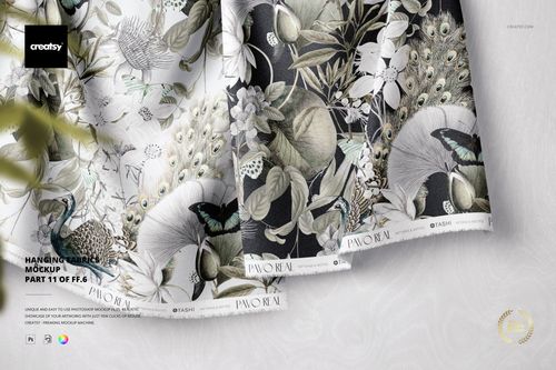 PSD mockup showing two textile samples with detailed nature-inspired prints, presented from an angled top perspective.