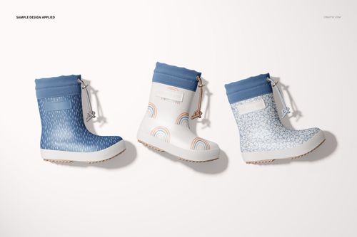 Kids rain boots mockup featuring three pairs with blue cuffs and varied patterns, arranged in a row, front perspective.