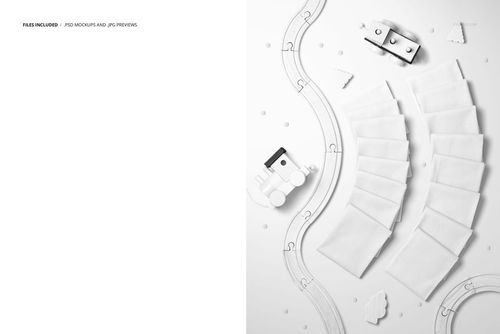 PSD mockup showing multiple white fabric swatches laid out in an arc with toy train elements and scattered beads.
