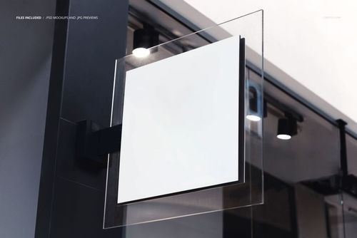 Square light box sign mockup mounted on a dark wall indoors, featuring a blank white display surface.