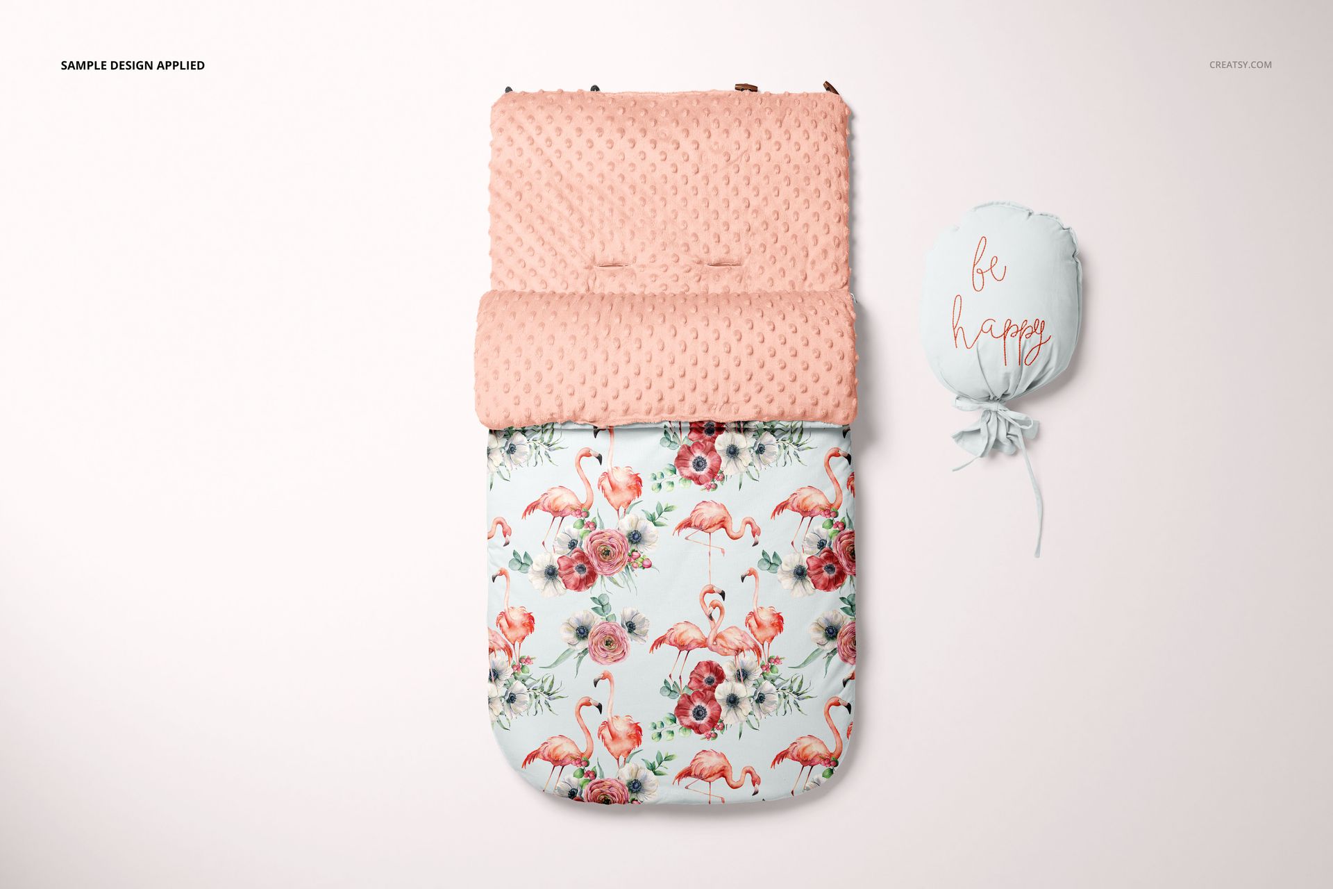 Front view of a baby sleeping bag mockup with a pink textured top and flamingo floral pattern on a light background.