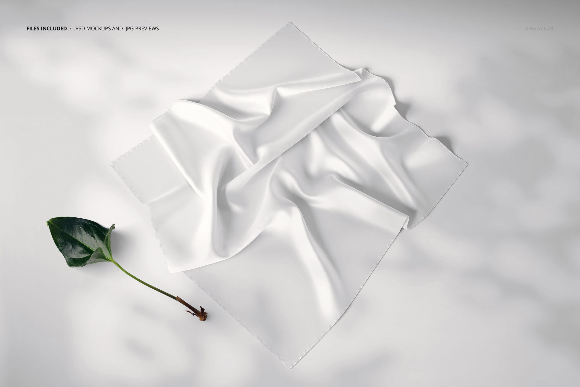 Square silk scarf mockup displayed in a perspective view, featuring soft folds and a plain white surface on a light background.