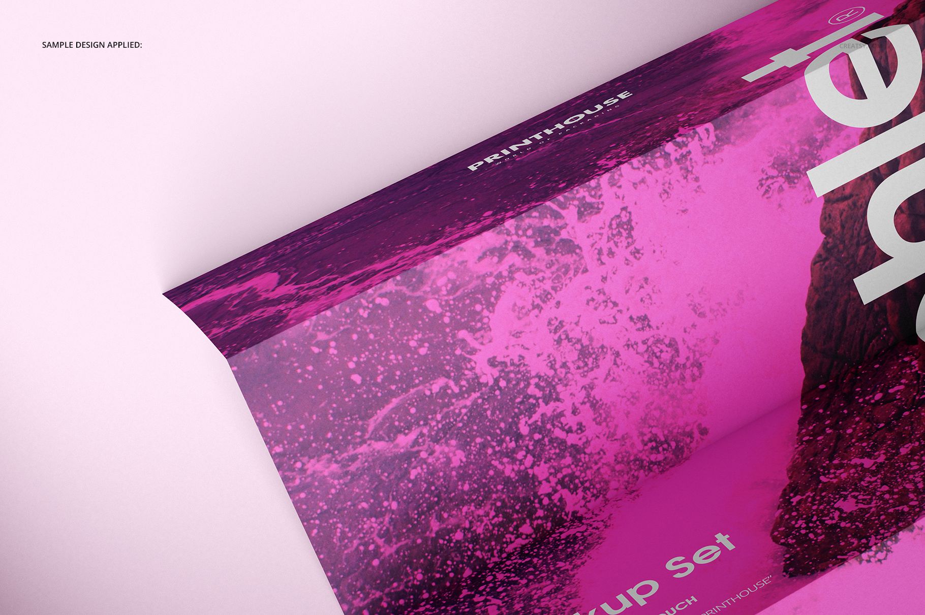 A4 pamphlet mockup with a vivid pink and purple abstract design, shown in a close-up angled top view.