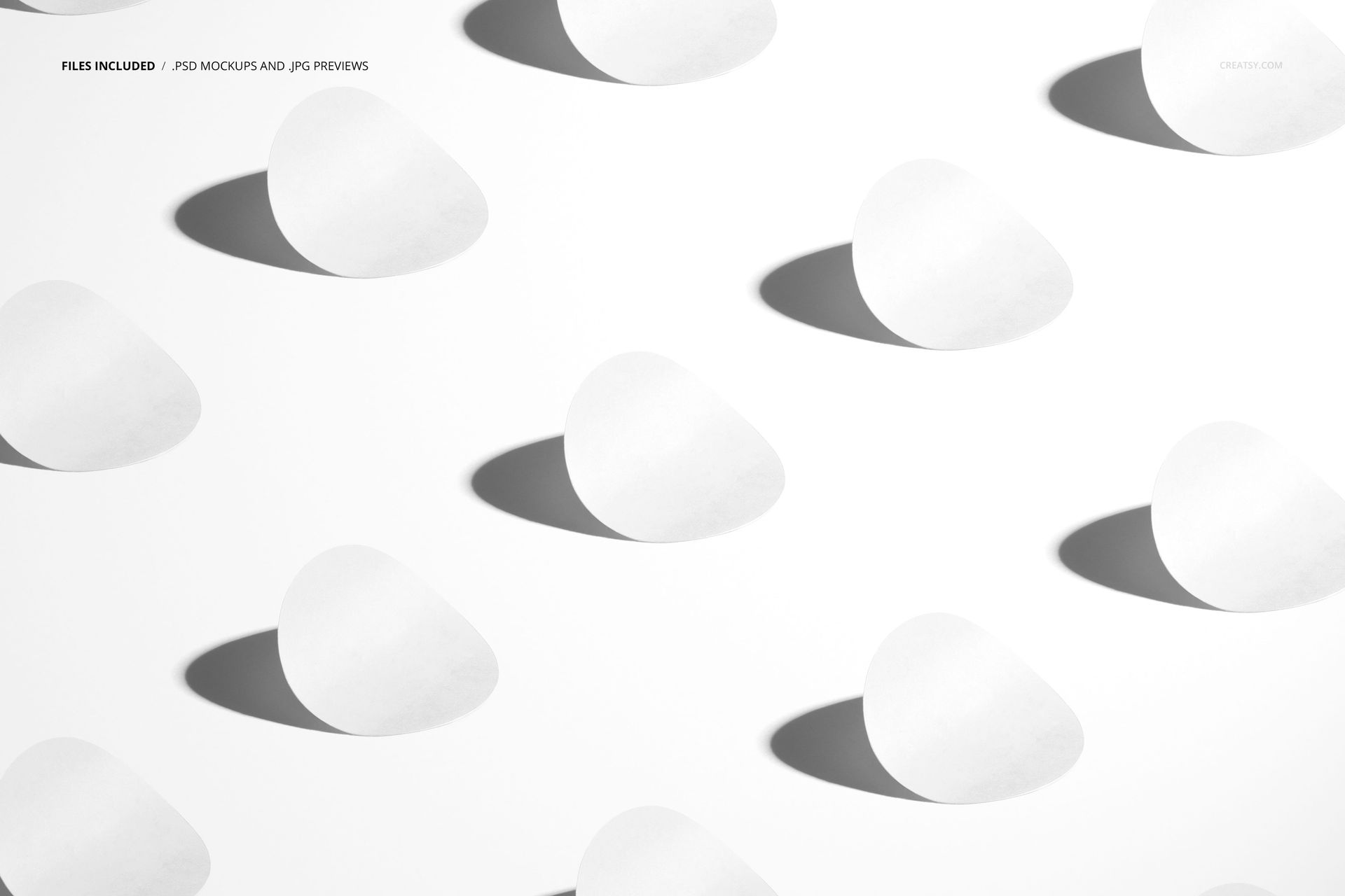 PSD mockup featuring several round stickers aligned in a row, white color, top-down perspective with shadows.