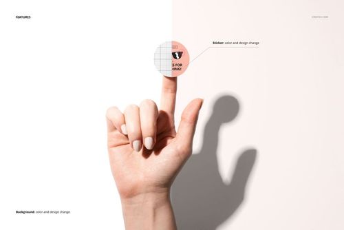 Close-up of a human hand with manicured nails displaying a circular sticker mockup on the fingertip against a two-tone backdrop.