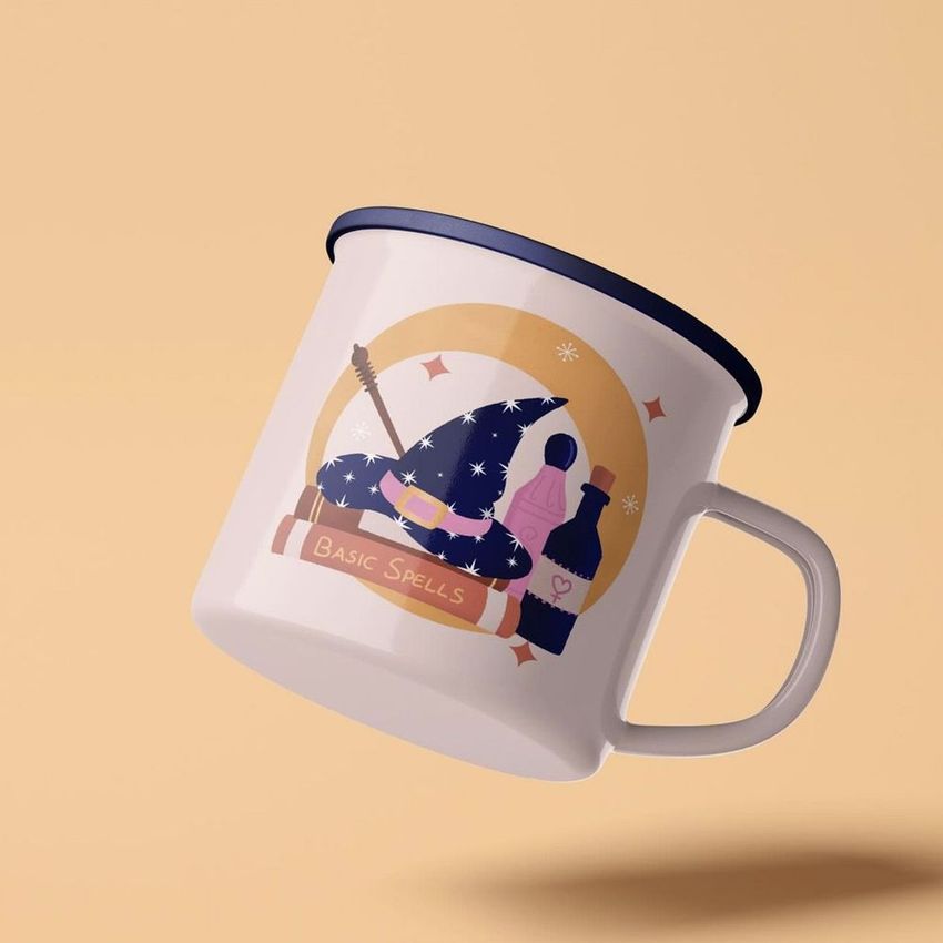 Enamel mug mockup with silver rim featuring a whimsical illustration of a witch hat, potion bottles, and magic book on a beige background.