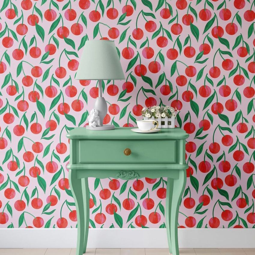 Classic console mockup featuring a mint green table with a lamp and decor, set against a cherry pattern wallpaper.