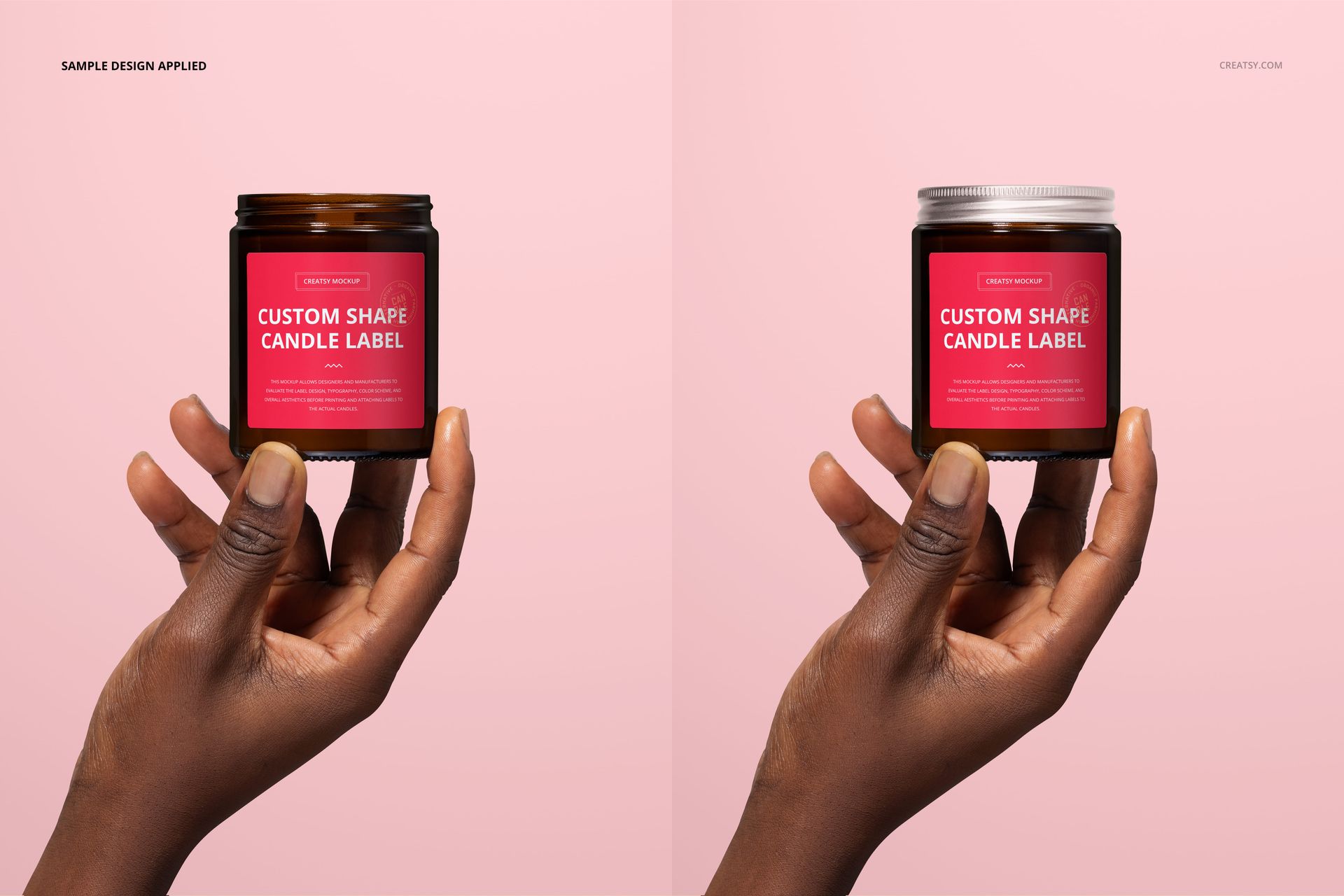 PSD mockup featuring an amber glass candle jar with custom red label, held by hand, displayed on a pale pink surface.