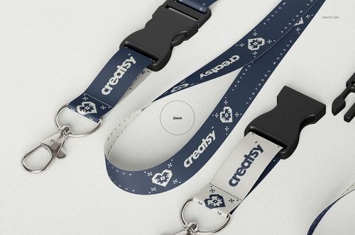 PSD mockup featuring blue lanyards with white geometric designs, metal hooks, and detachable black clasps on a flat surface.