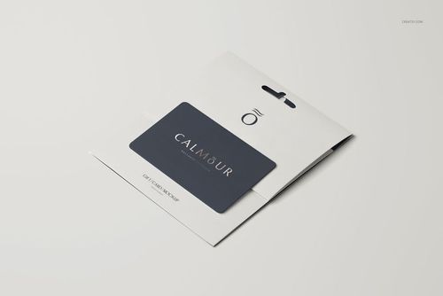 Gift card mockup featuring a dark rectangular card on a white folded holder, shown from a front angled view.