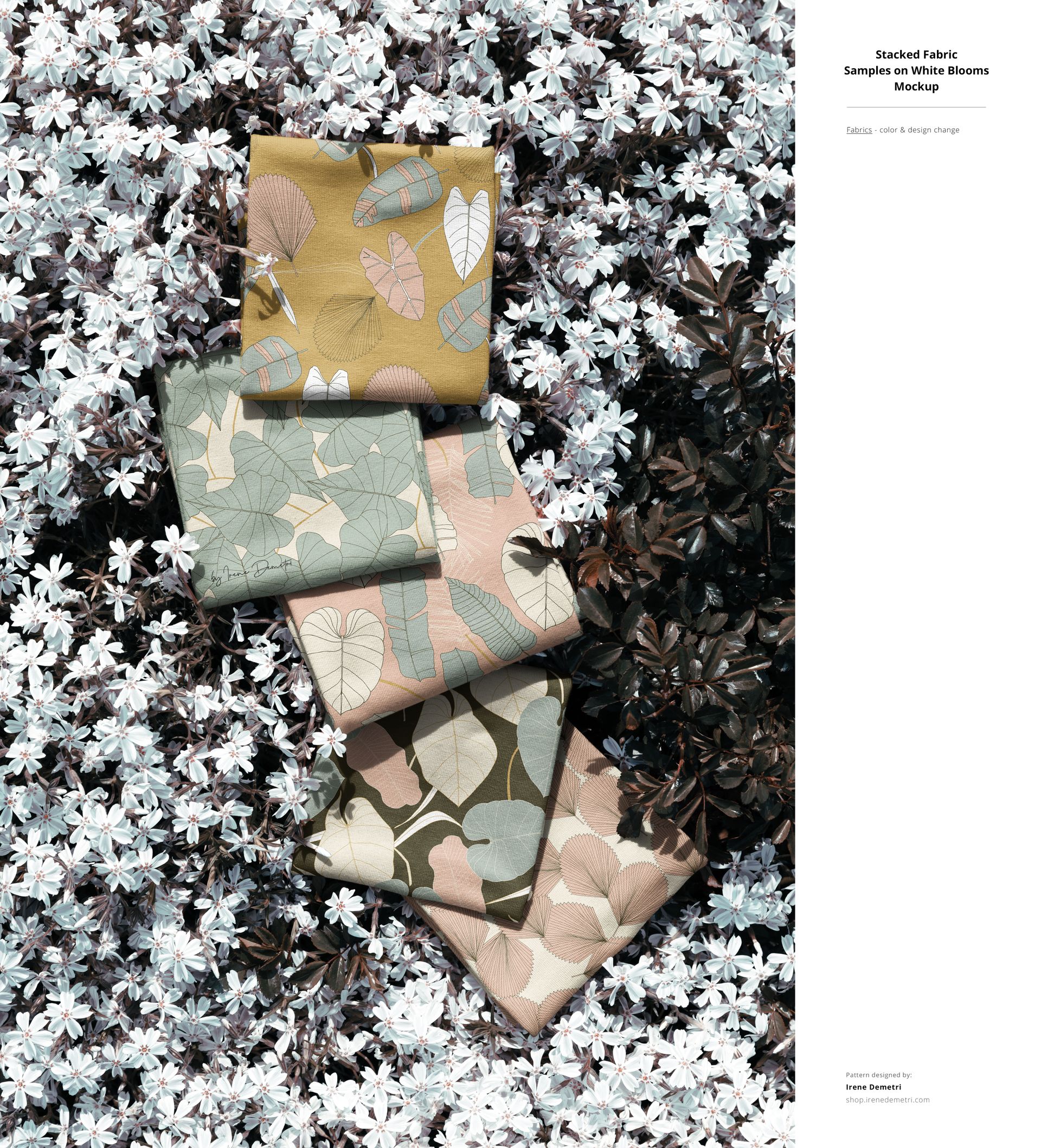 PSD mockup showing patterned fabric swatches with nature-inspired prints, placed on fresh outdoor flower ground cover.