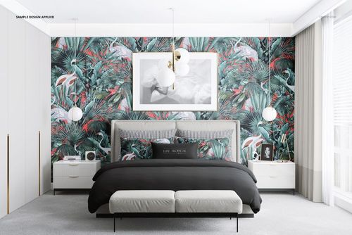 Front view of a stylish bedroom mockup showing a bed with monochrome bedding, tropical accent pillows, and leafy wallpaper.