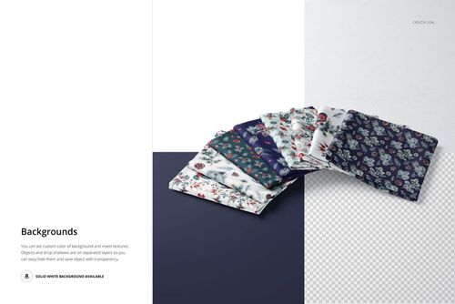 PSD mockup showing multiple folded fabric samples with botanical prints, presented on contrasting dark and light surfaces.