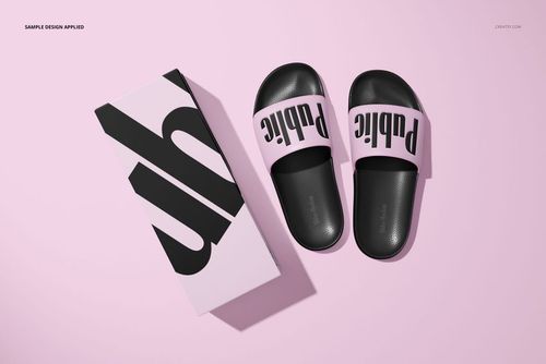 PSD mockup of slide sandals in black and light pink, displayed alongside a patterned box on a pastel pink background.