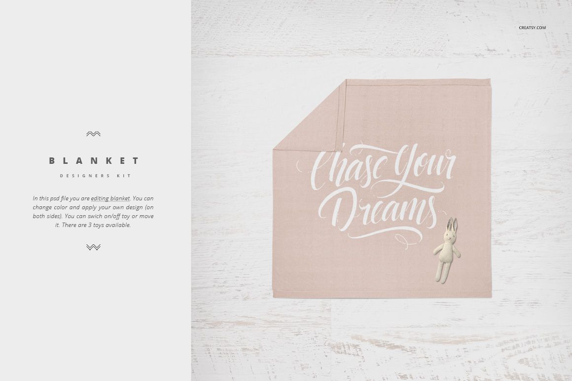 Soft pink crib blanket mockup with white script text and a small plush bunny, displayed on a light wood surface.