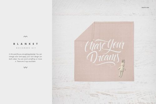 Soft pink crib blanket mockup with white script text and a small plush bunny, displayed on a light wood surface.