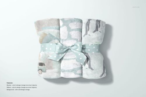 PSD mockup of a bundled fleece blanket set with pastel illustrations and a decorative bow, displayed on a light background.