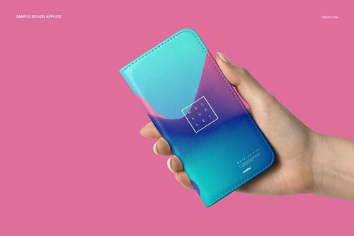 Foldable iPhone case mockup featuring a vibrant blue and pink pattern, displayed in hand over a solid pink backdrop.