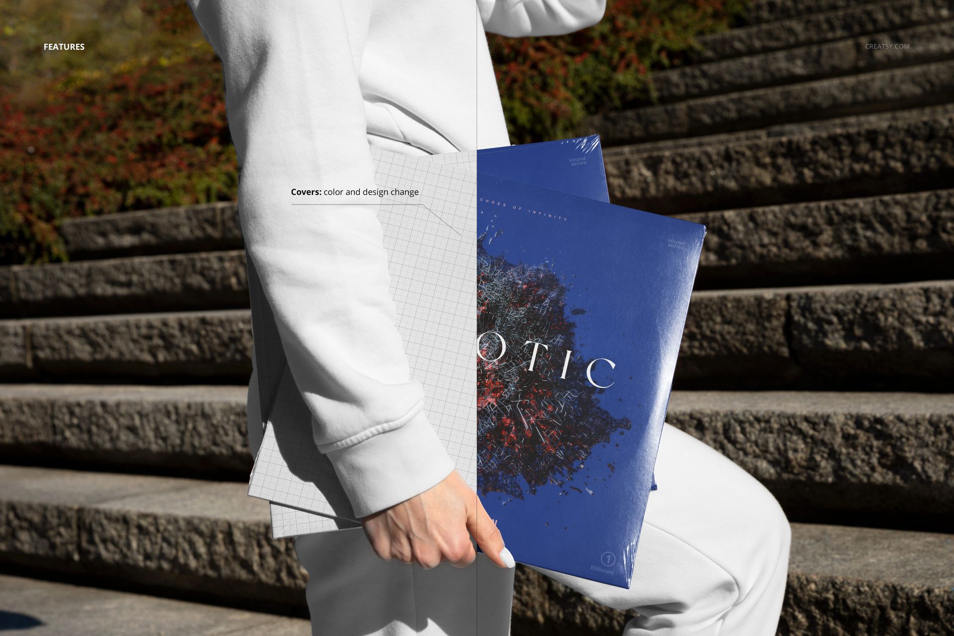 Mockup showing a person gripping two vinyl record sleeves, one with a grid pattern, in a sunlit outdoor setting.