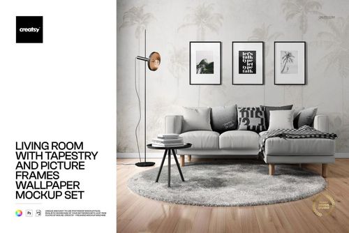Modern living room scene with a gray sofa, round rug, tapestry wall art, and framed pictures in a PSD mockup.