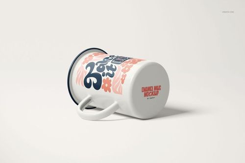 Enamel mug mockup with a handle, decorated with pink flowers and blue text, shown from a side angle.