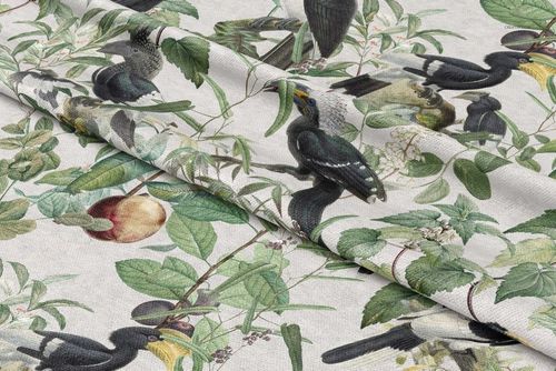PSD mockup of upholstery fabric with a nature-inspired design, displaying birds and foliage on a light background.