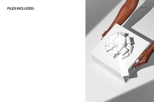 Top view of hands holding a white gift box with a large bow, casting shadows on a light surface in a PSD mockup.