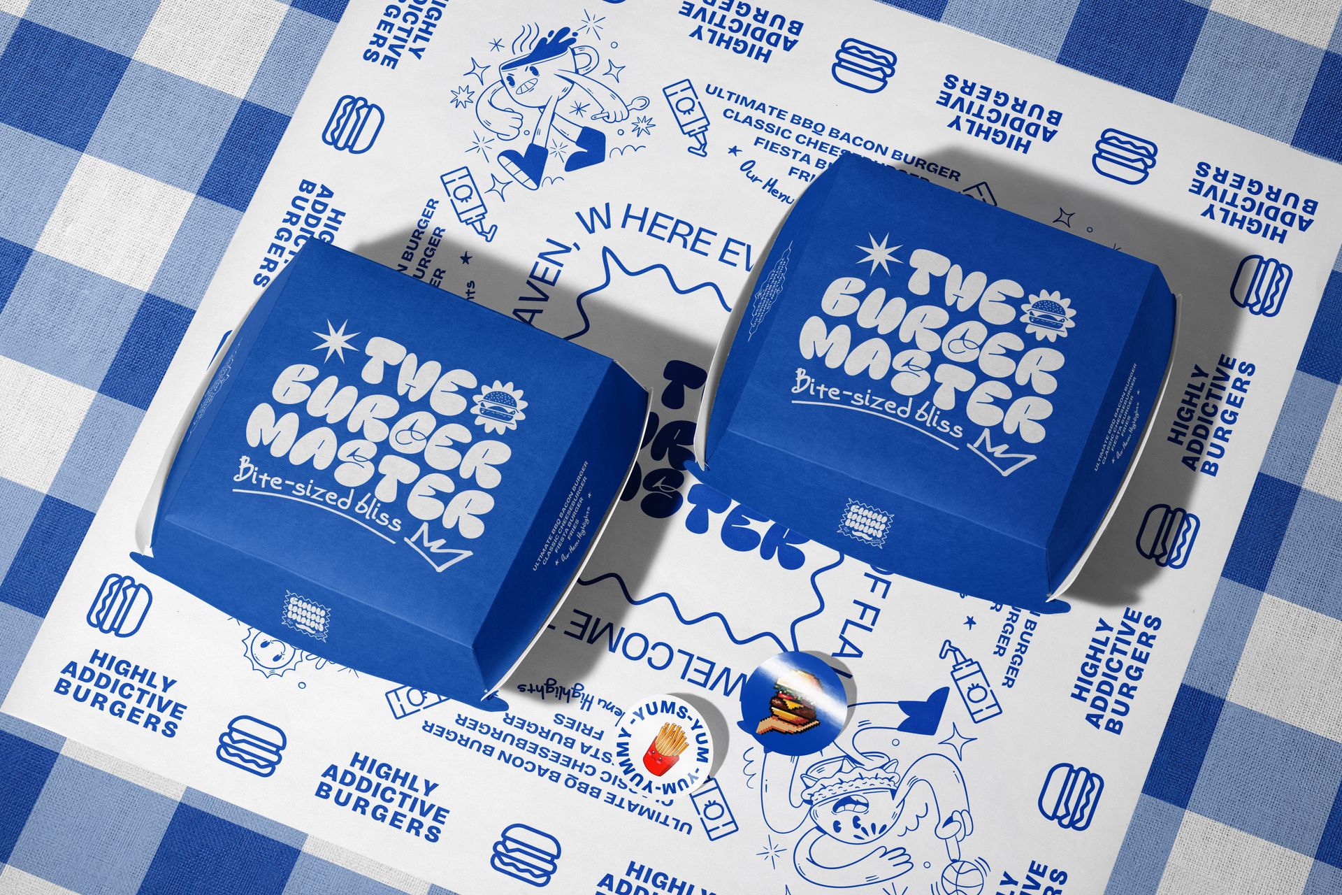PSD mockup featuring two blue rectangular burger boxes with white branding, placed on illustrated food-themed wrapping paper.