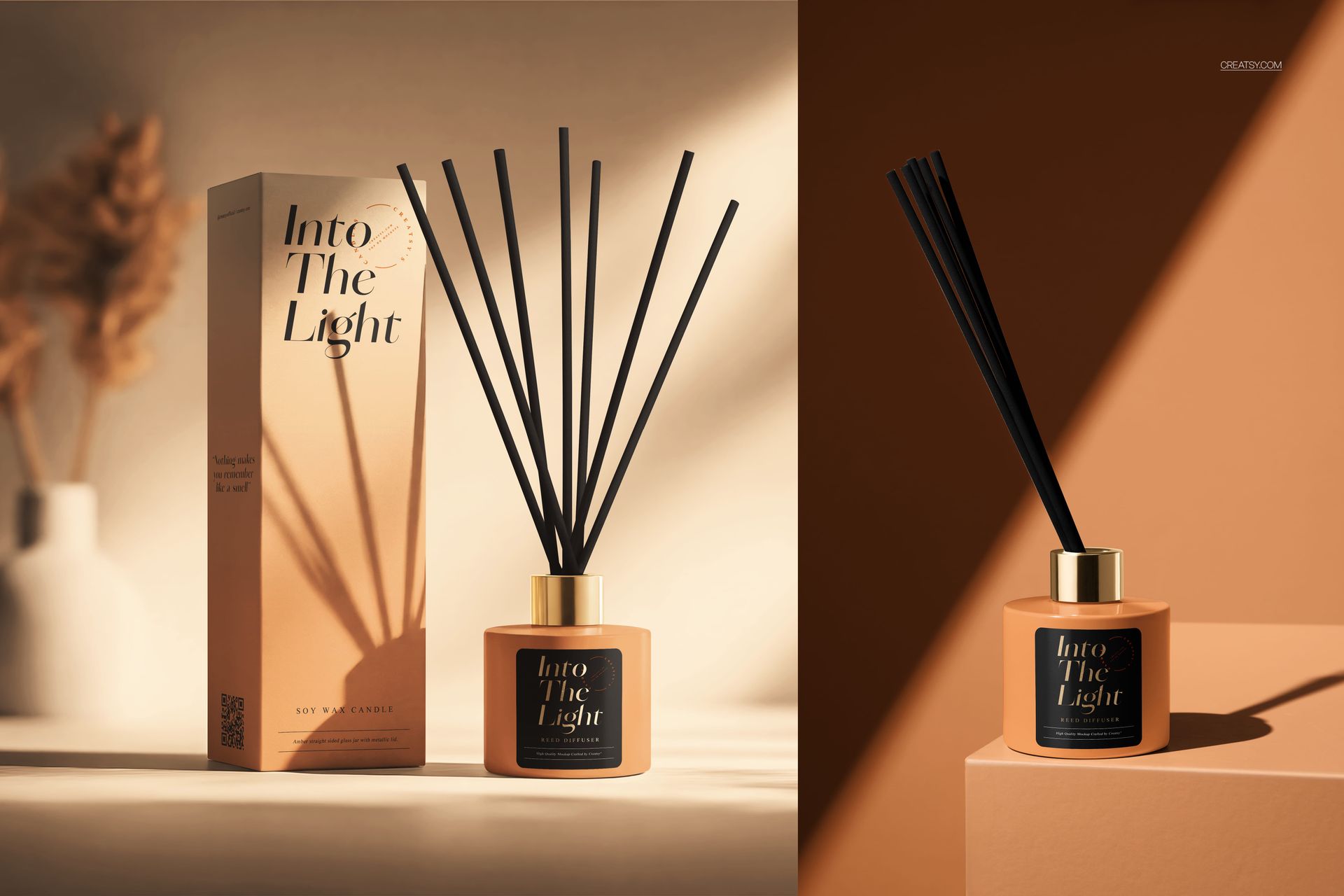 Painted glass reed diffuser mockup with black sticks and gold lid, shown next to a tall rectangular box in soft lighting.