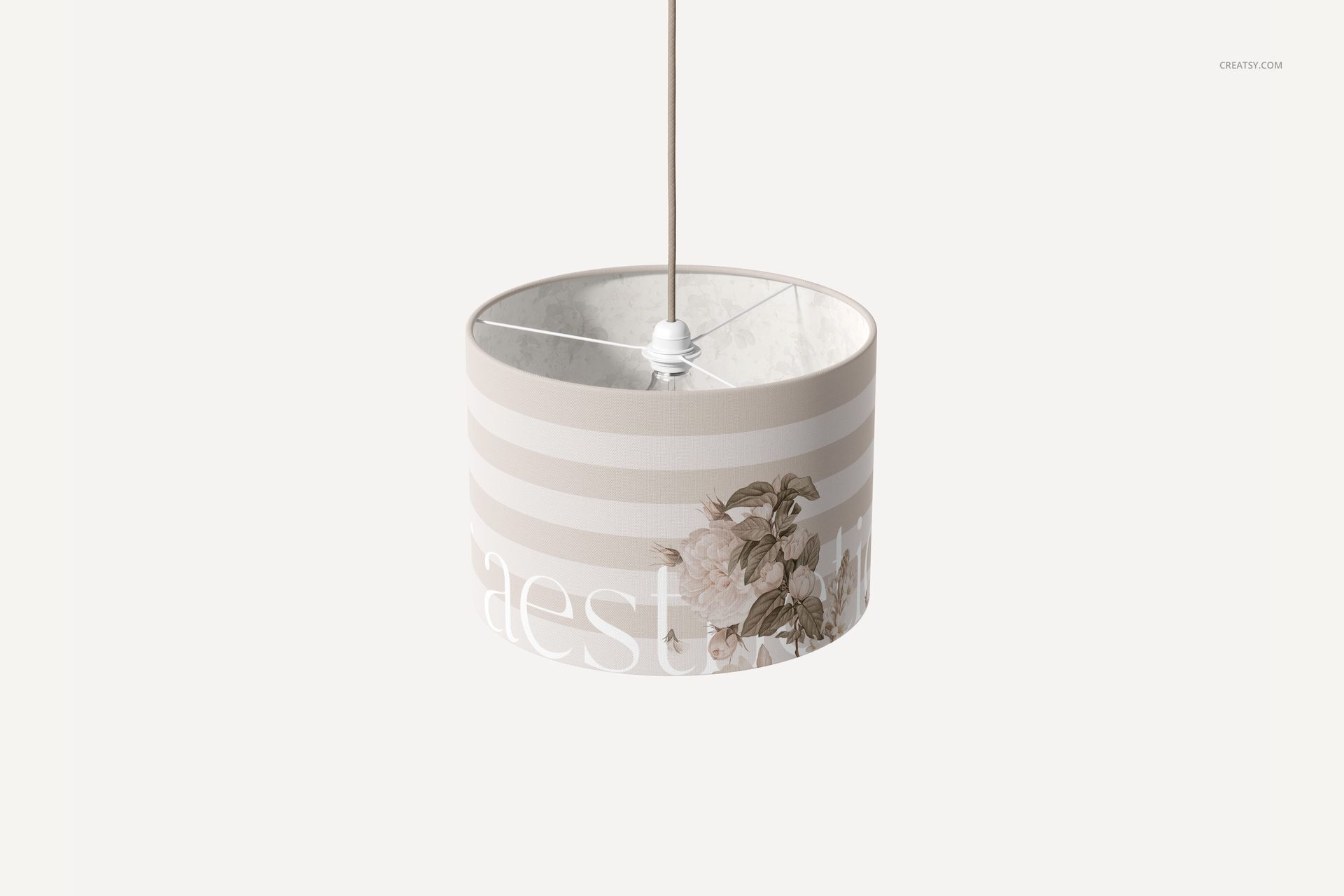 PSD mockup of a cylindrical lamp shade featuring muted stripes and delicate flowers, suspended on a simple cord.