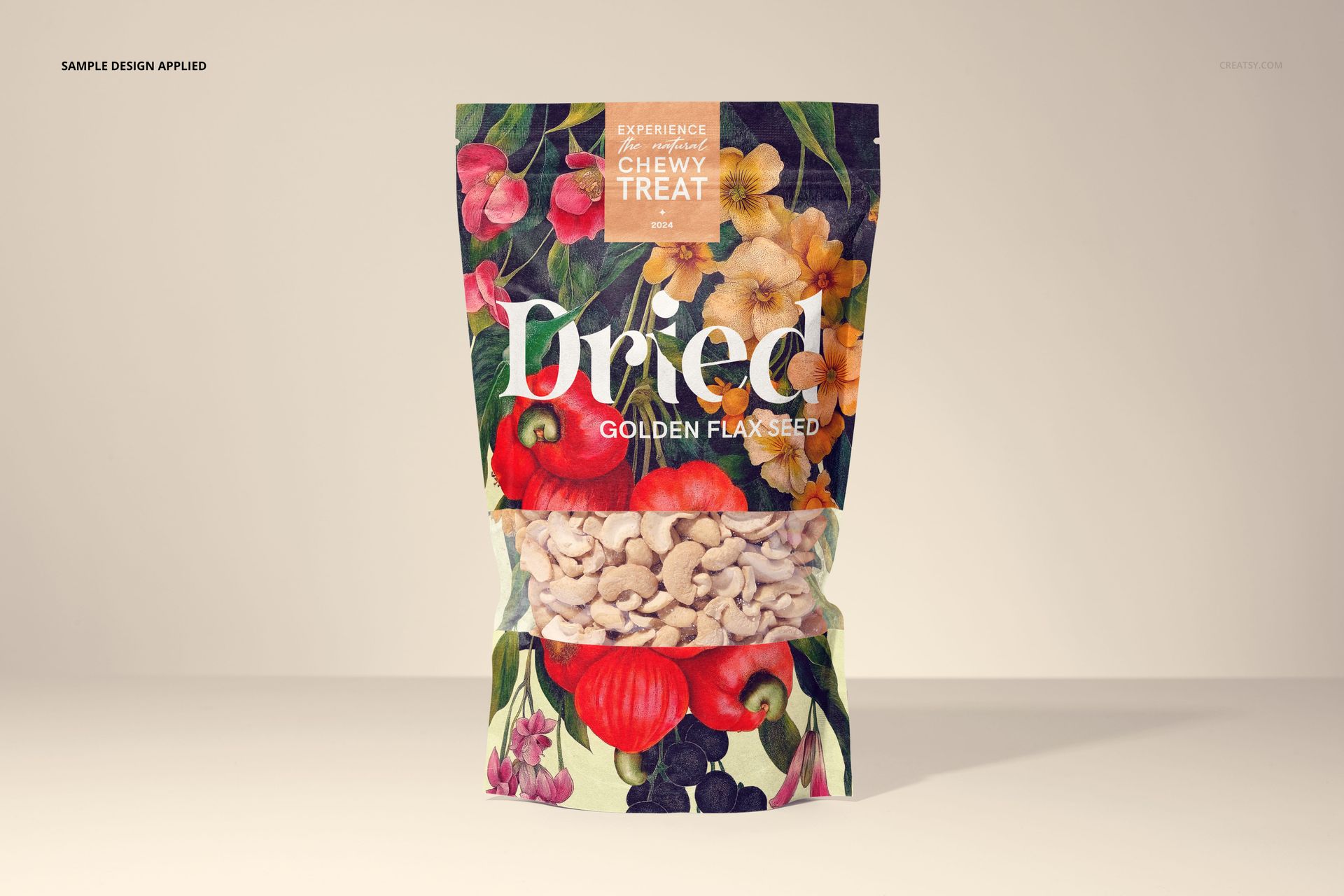 Front view of a paper pouch packaging mockup filled with cashews, featuring a colorful floral and fruit pattern.