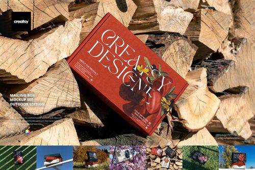 Red mailing box mockup displayed on chopped wood logs in an outdoor setting, viewed from above.