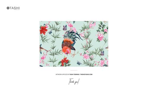 Furoshiki fabric wrap mockup featuring a rooster, floral pattern, and butterflies on a pale green surface, centered layout.