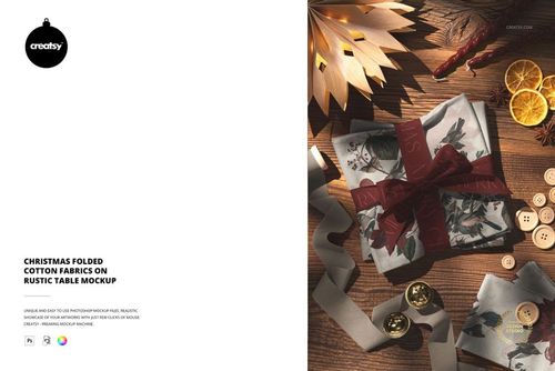 Christmas folded cotton fabrics mockup featuring festive patterns, ribbon, and holiday props on a wooden surface.