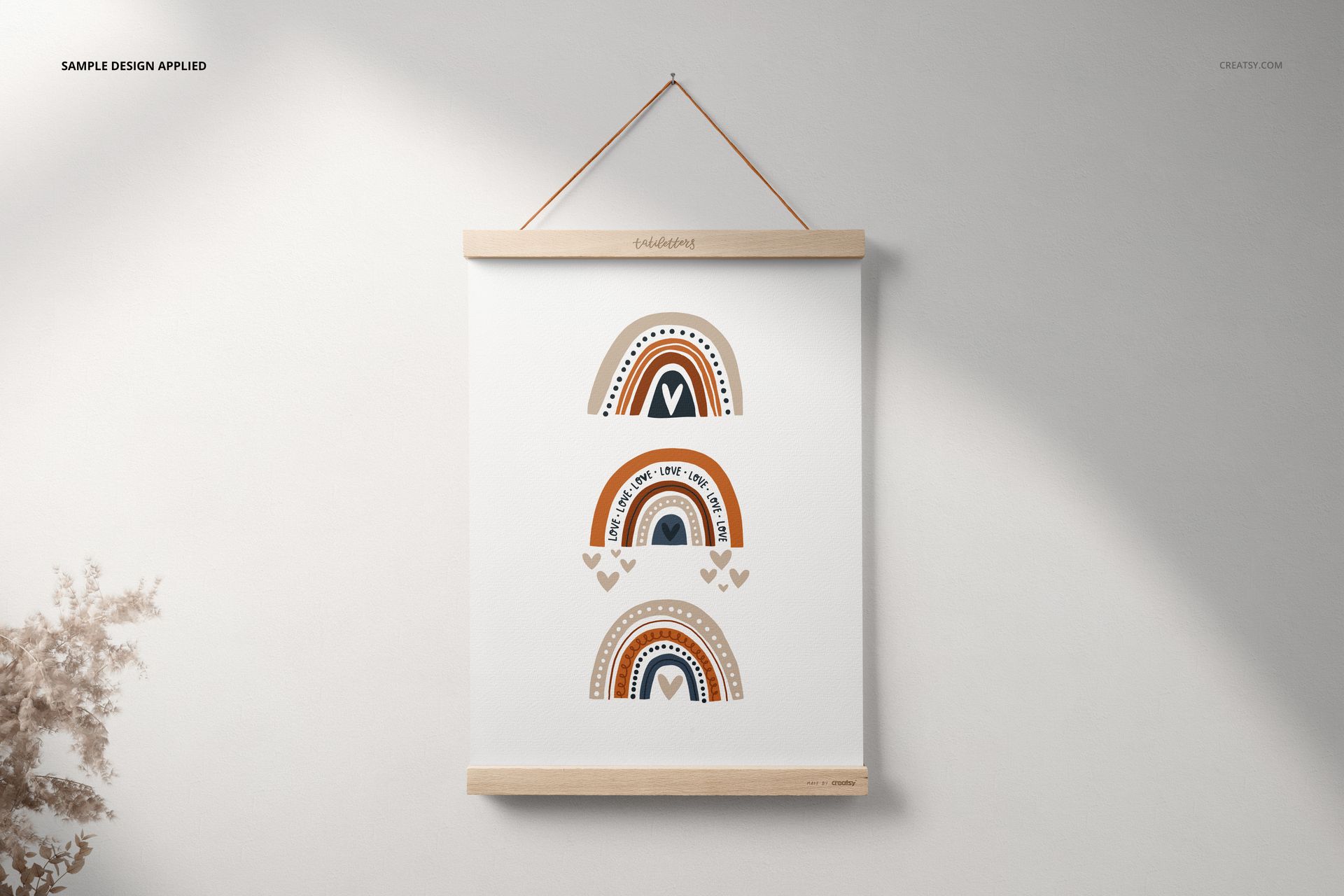 A3 poster mockup featuring minimalist rainbow artwork in brown and orange, displayed with wooden top and bottom hangers.