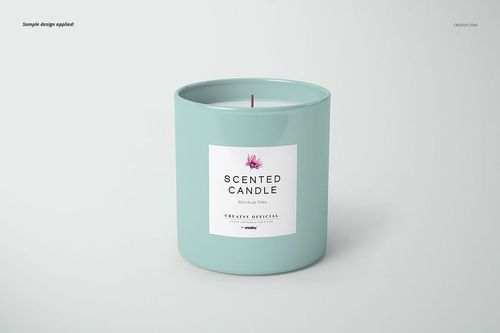 Cylindrical candle mockup in a solid pastel blue jar, featuring a centered label and visible wick, set against a plain backdrop.